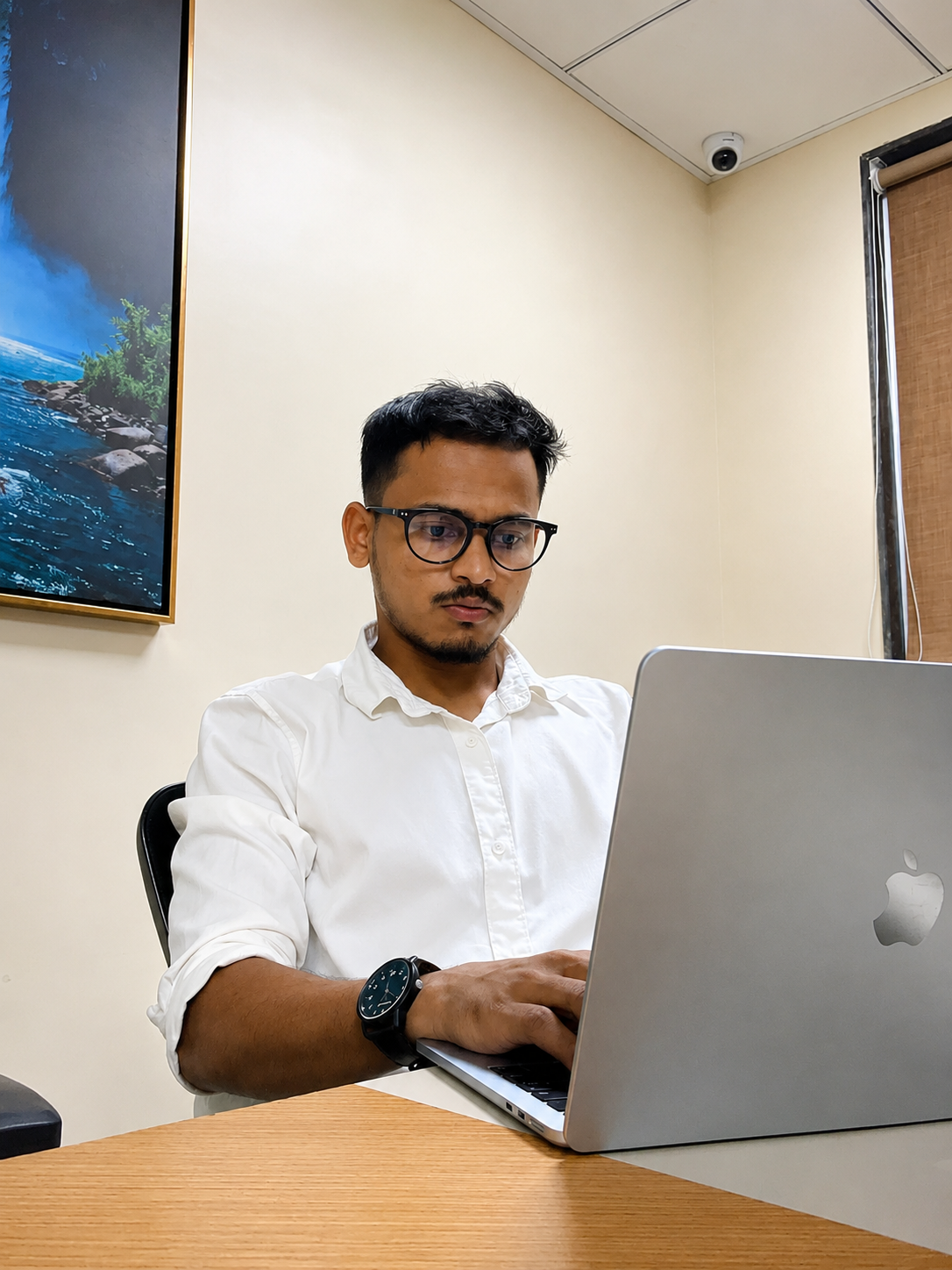 Pravin Borse working at his desk